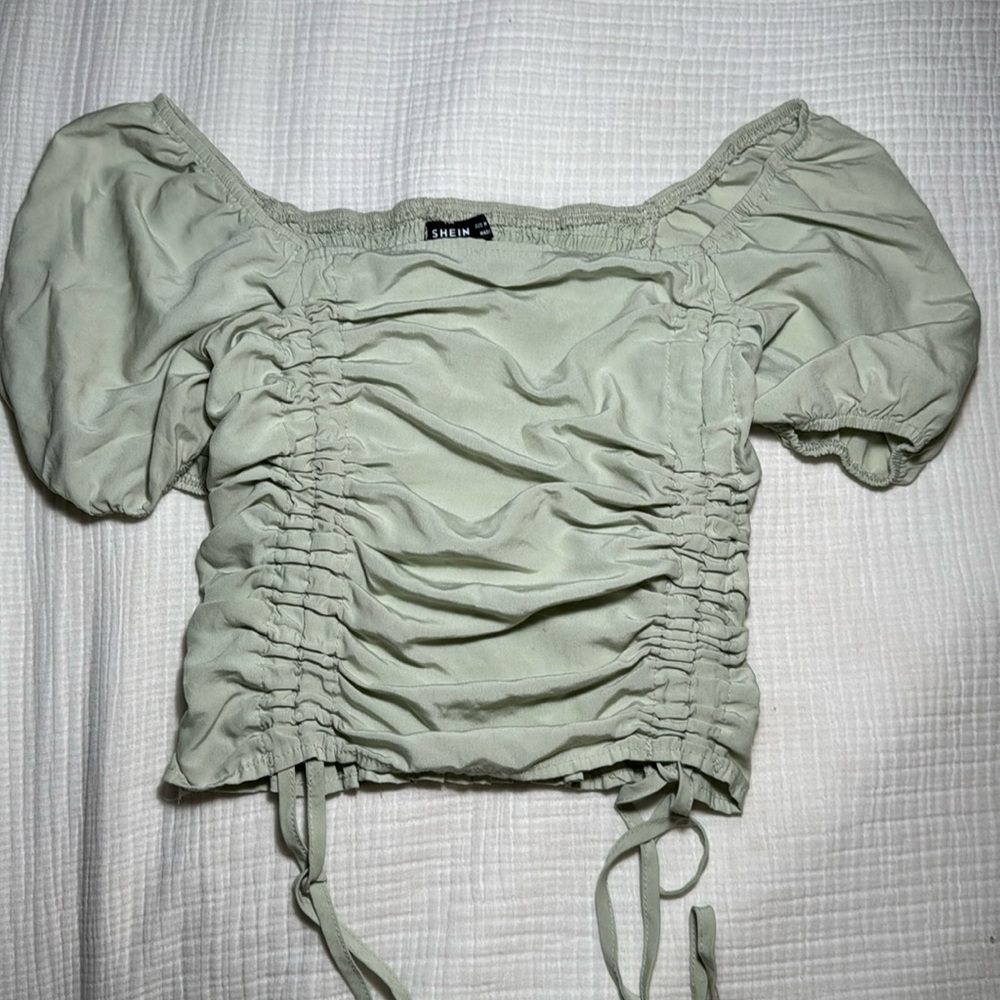light green ruffle top